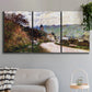 Three-panel canvas wall art featuring country road through village, displayed in a modern living room above a sofa.