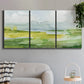 Three-panel canvas wall art featuring lowland wetlands with reflective water, displayed in a modern living room above a sofa.