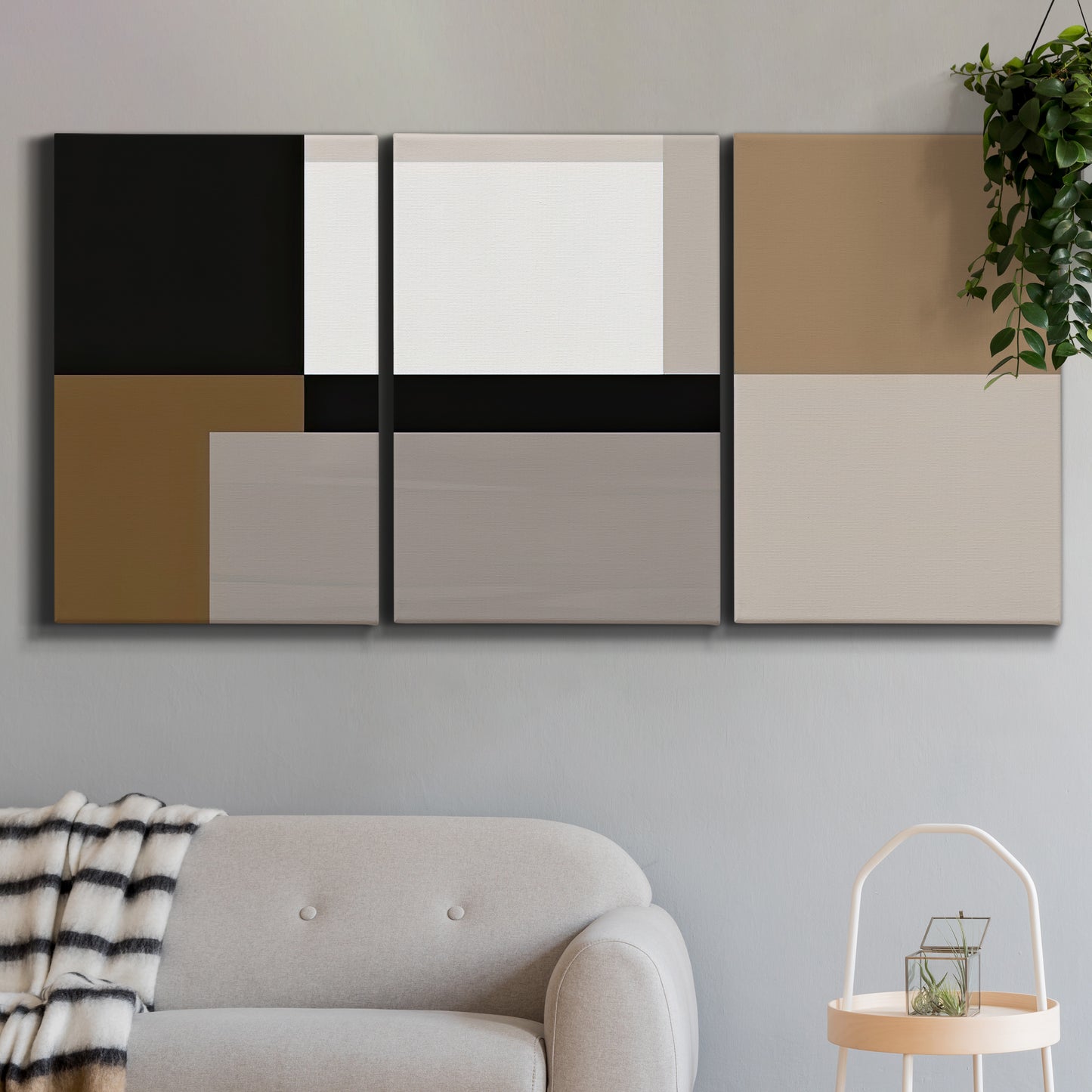 Three-panel canvas wall art featuring geometric abstract centerpoint composition, displayed in a modern living room above a sofa.