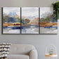 Three-panel canvas wall art featuring layered abstract mountain forms, displayed in a modern living room above a sofa.