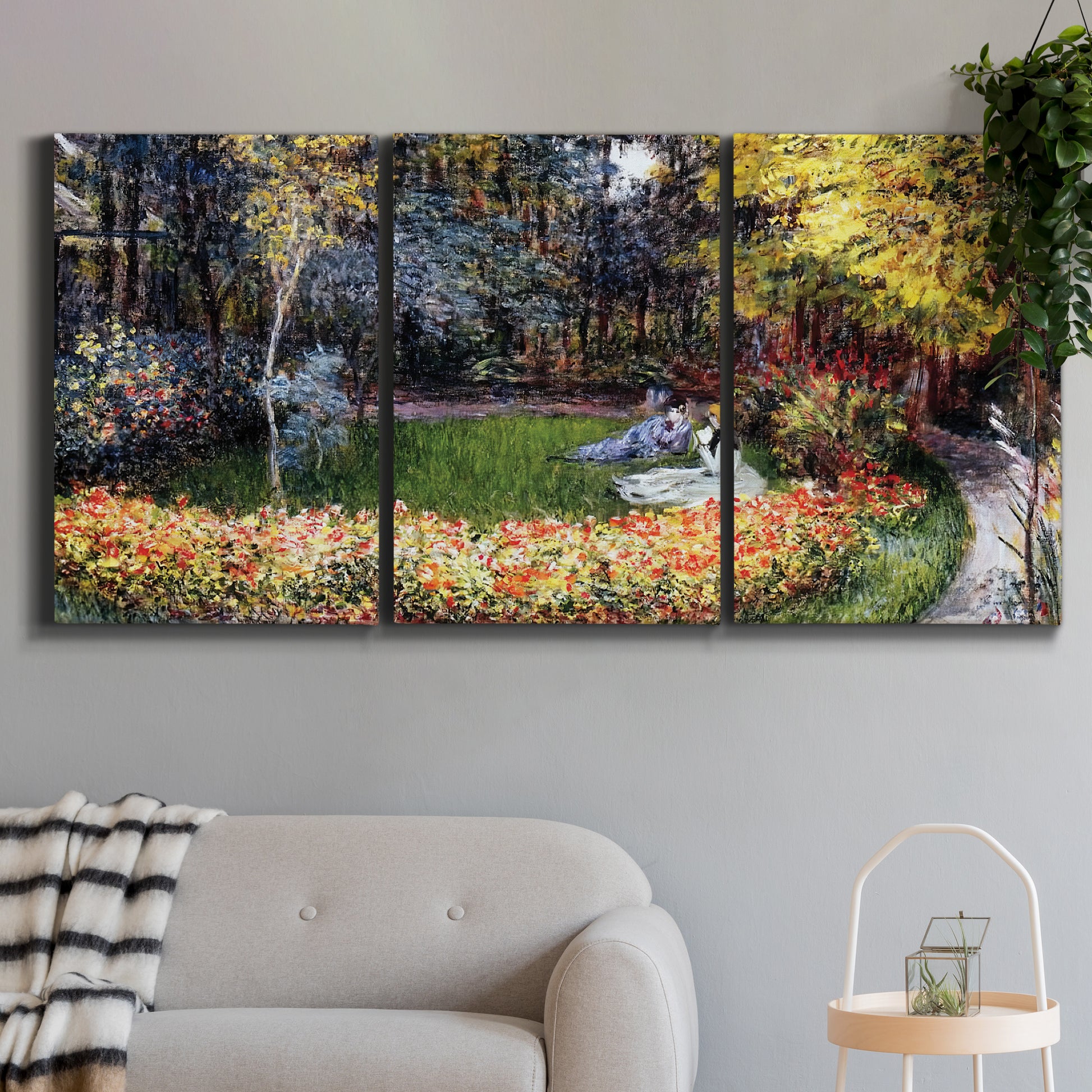 Three-panel canvas wall art featuring garden in full bloom by coast, displayed in a modern living room above a sofa.