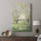 Canvas art print featuring a tranquil outdoor scene with soft greens and gentle shadows displayed in a modern interior space.