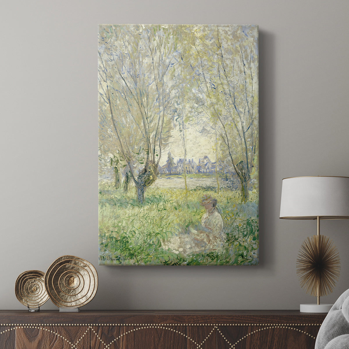 Canvas art print featuring a tranquil outdoor scene with soft greens and gentle shadows displayed in a modern interior space.