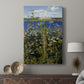 Canvas art print featuring a detailed view of flowering plants in a soft natural setting displayed in a modern interior space.