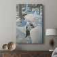 Canvas art print featuring a Nordic forest scene with tracks in fresh snow and bare winter trees displayed in a modern interior space.