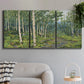 Three-panel canvas wall art featuring woodland forest scene with tall trees, displayed in a modern living room above a sofa.