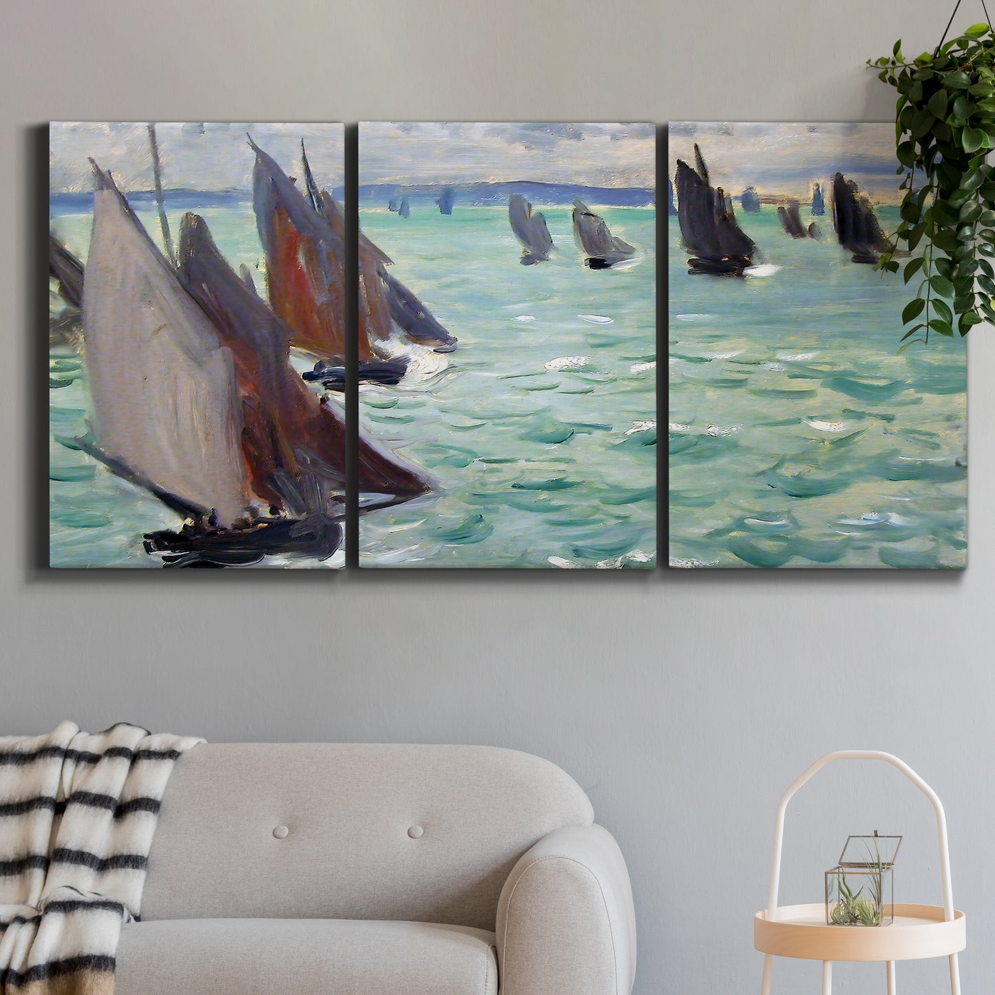 Three-panel canvas wall art featuring sailboat regatta near coastal village, displayed in a modern living room above a sofa.