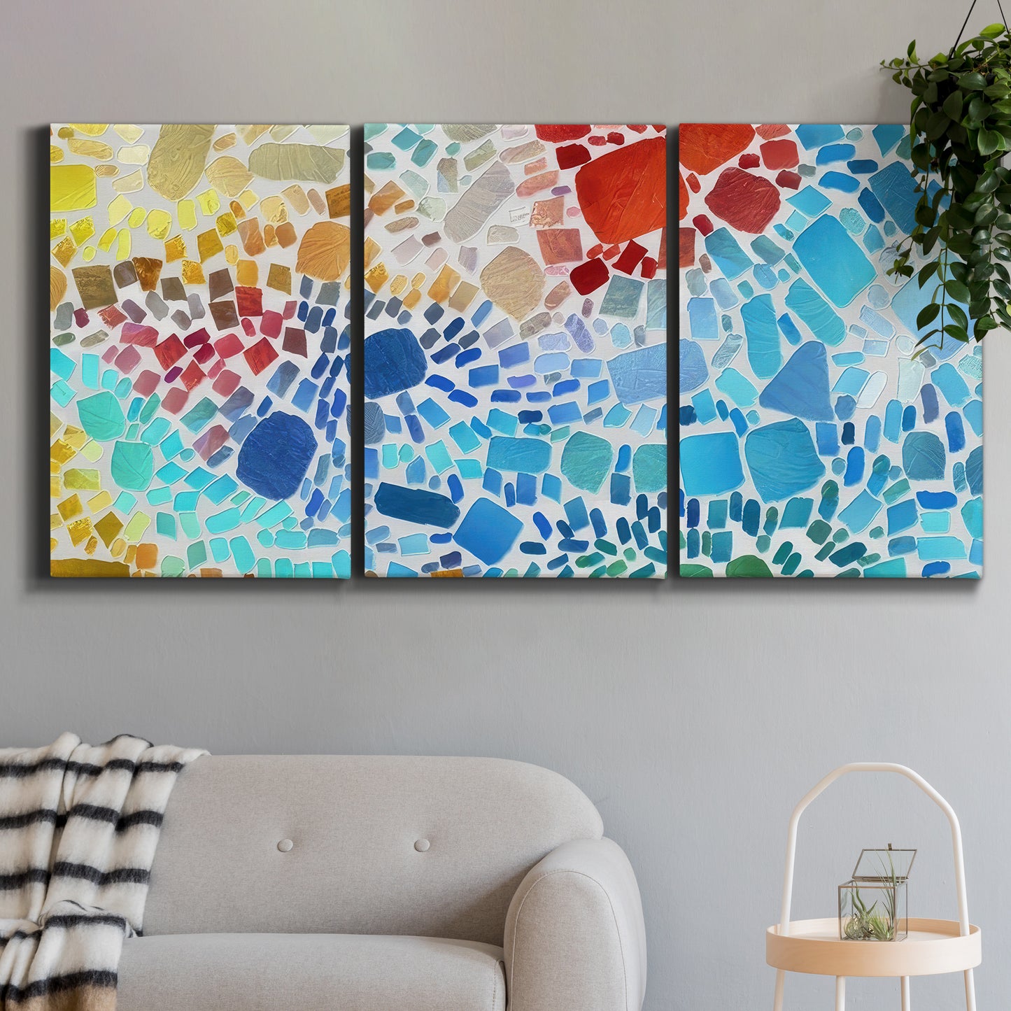 Three-panel canvas wall art featuring open landscape with landing strip, displayed in a modern living room above a sofa.