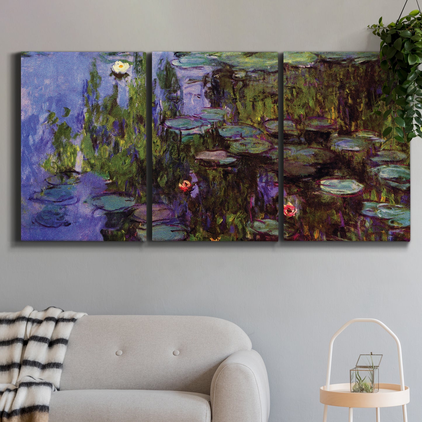 Three-panel canvas wall art featuring water lilies on calm pond, displayed in a modern living room above a sofa.