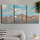 Three-panel canvas wall art featuring soft pastel western hills landscape, displayed in a modern living room above a sofa.