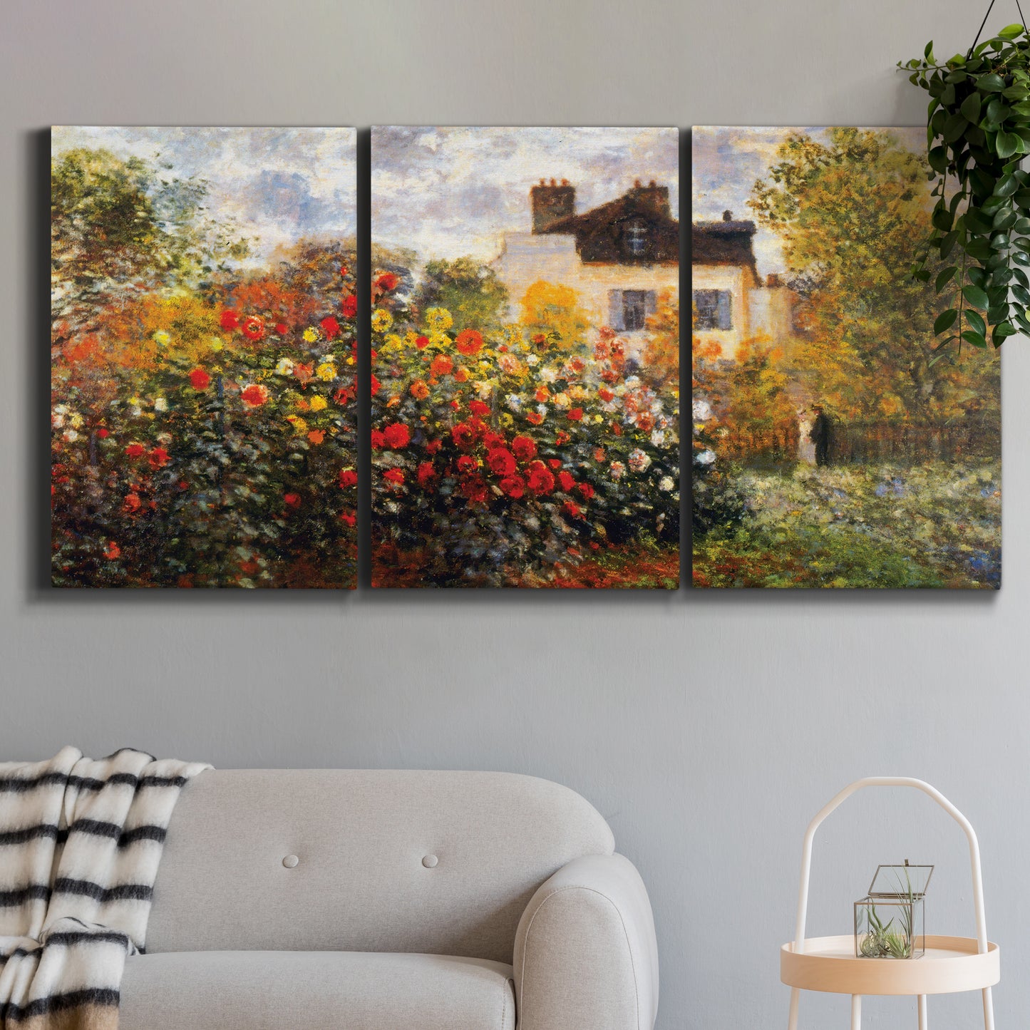 Three-panel canvas wall art featuring farm buildings in rural normandy, displayed in a modern living room above a sofa.