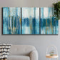 Three-panel canvas wall art featuring layered abstract earth tones, displayed in a modern living room above a sofa.