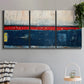 Three-panel canvas wall art featuring weathered coastal dock scene, displayed in a modern living room above a sofa.