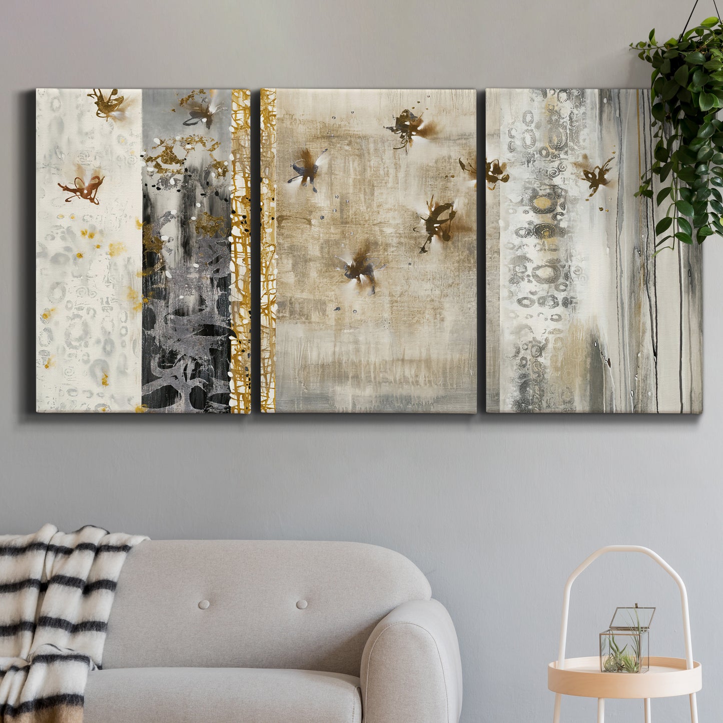 Three-panel canvas wall art featuring abstract willow inspired vertical forms, displayed in a modern living room above a sofa.