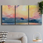 Three-panel canvas wall art featuring prismatic watercolor coastal seascape, displayed in a modern living room above a sofa.