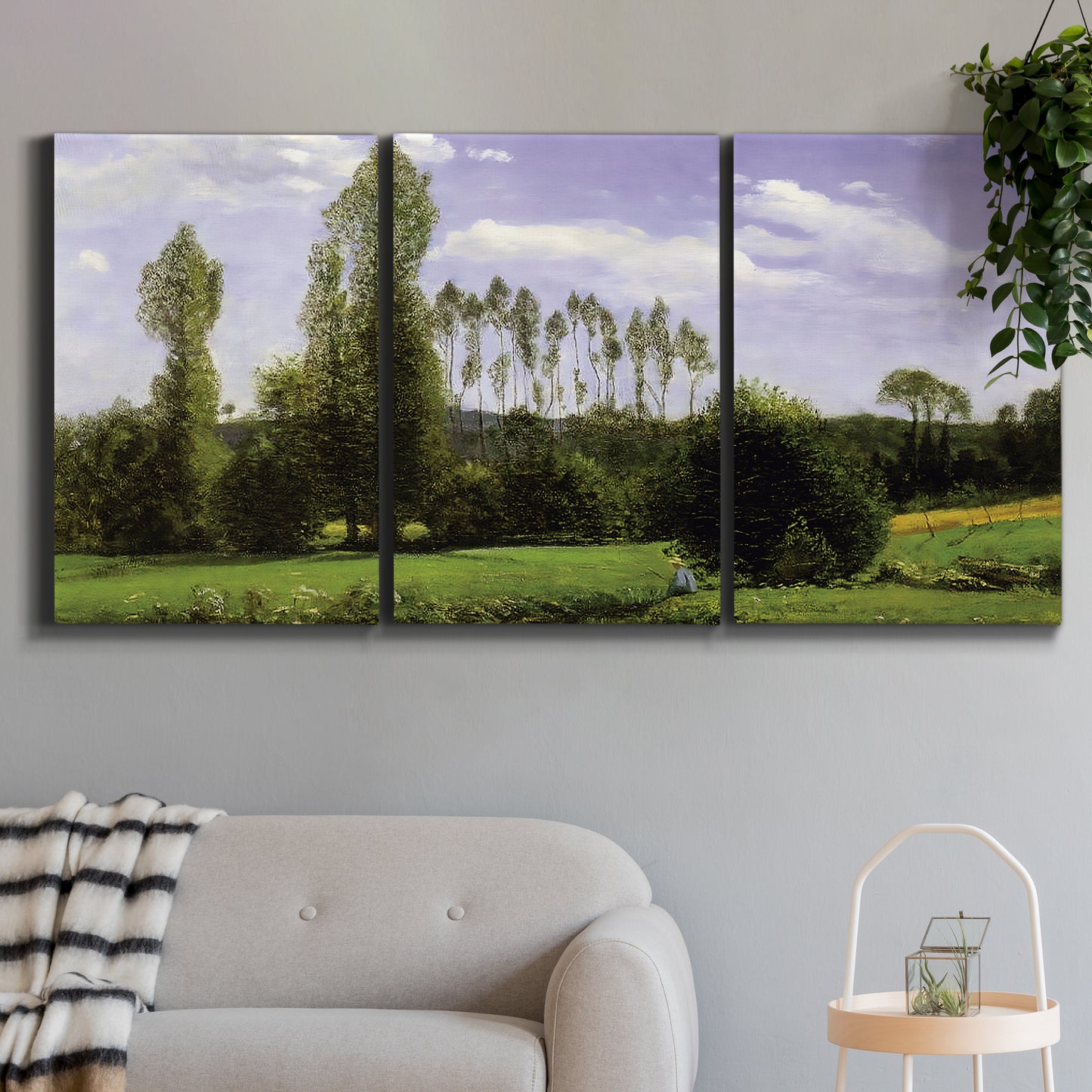 Three-panel canvas wall art featuring open landscape near le havre, displayed in a modern living room above a sofa.