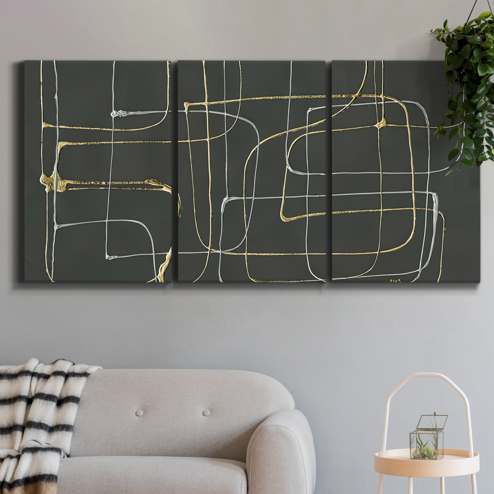 Three-panel canvas wall art featuring linear abstract conduit pattern, displayed in a modern living room above a sofa.