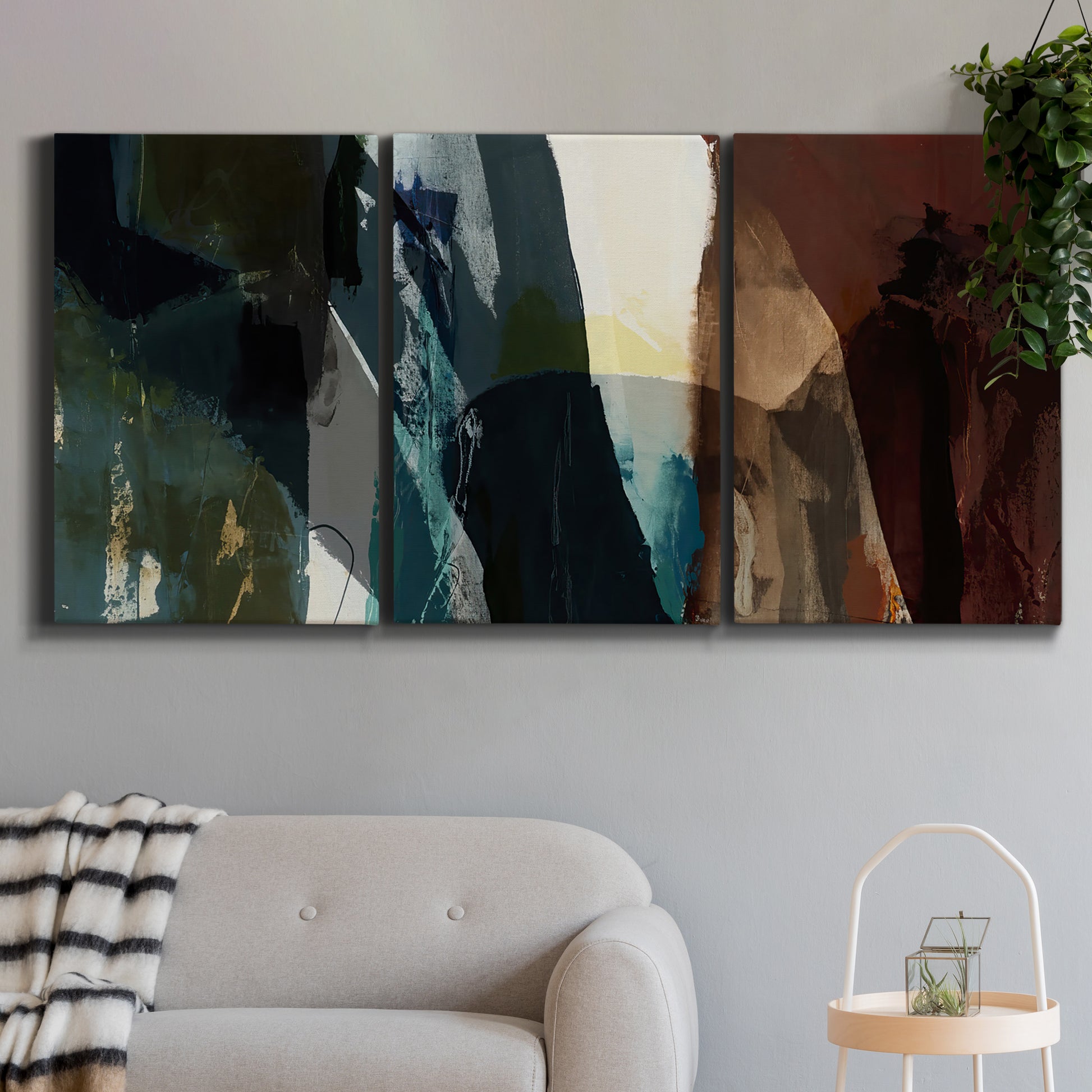 Three-panel canvas wall art featuring layered neutral abstract textures, displayed in a modern living room above a sofa.