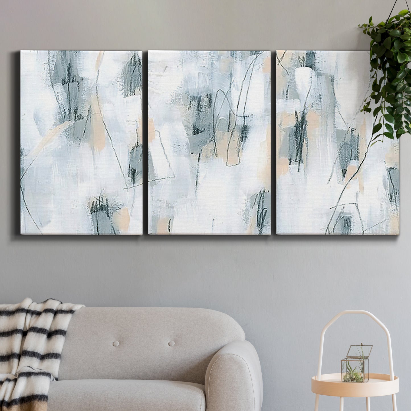 Three-panel canvas wall art featuring industrial textured abstract hatch patterns, displayed in a modern living room above a sofa.