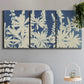 Three-panel canvas wall art featuring delicate lupine floral composition, displayed in a modern living room above a sofa.
