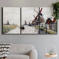 Three-panel canvas wall art featuring windmills beside calm water, displayed in a modern living room above a sofa.