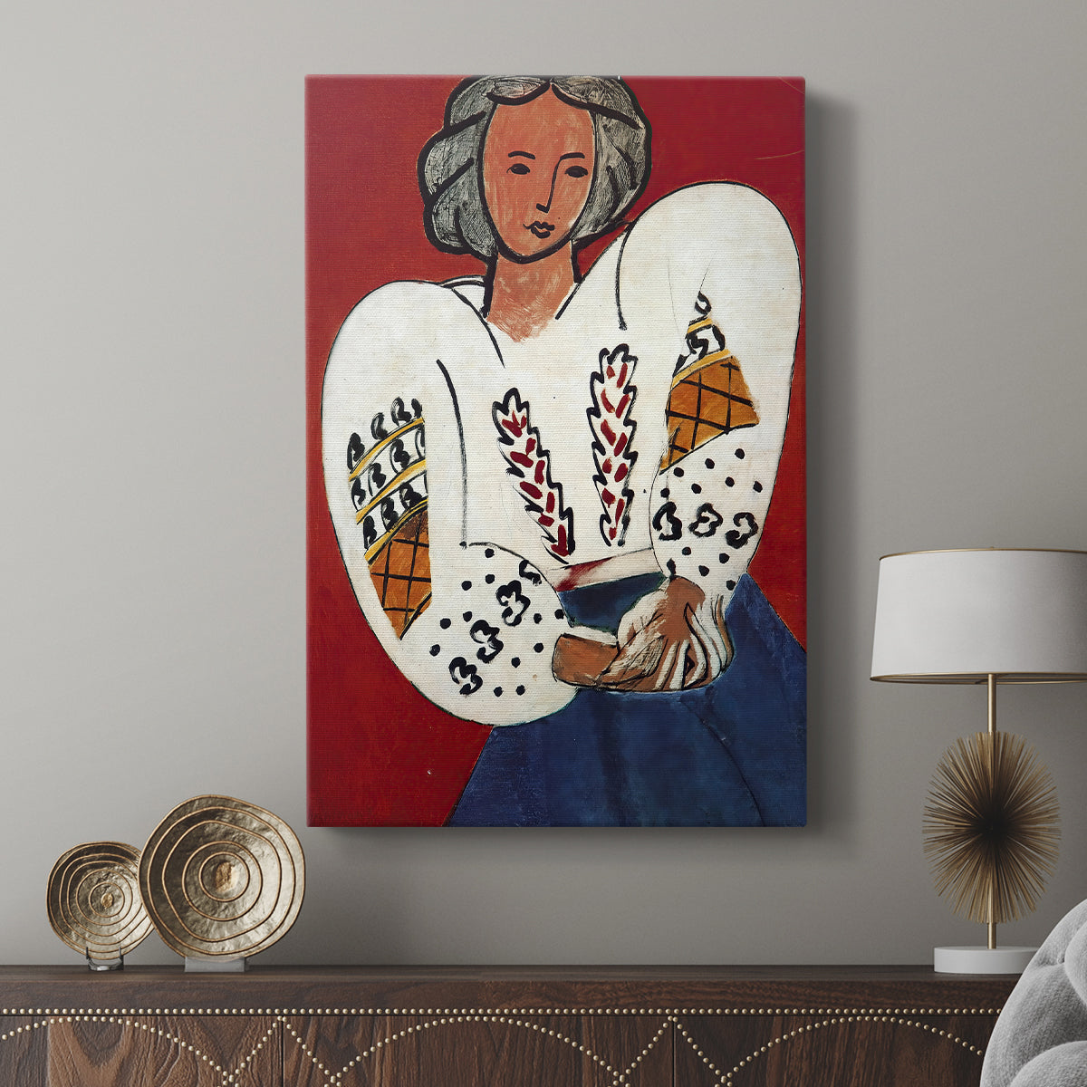 Canvas art print featuring a bright portrait with decorative detail and flat color displayed in a modern interior space.
