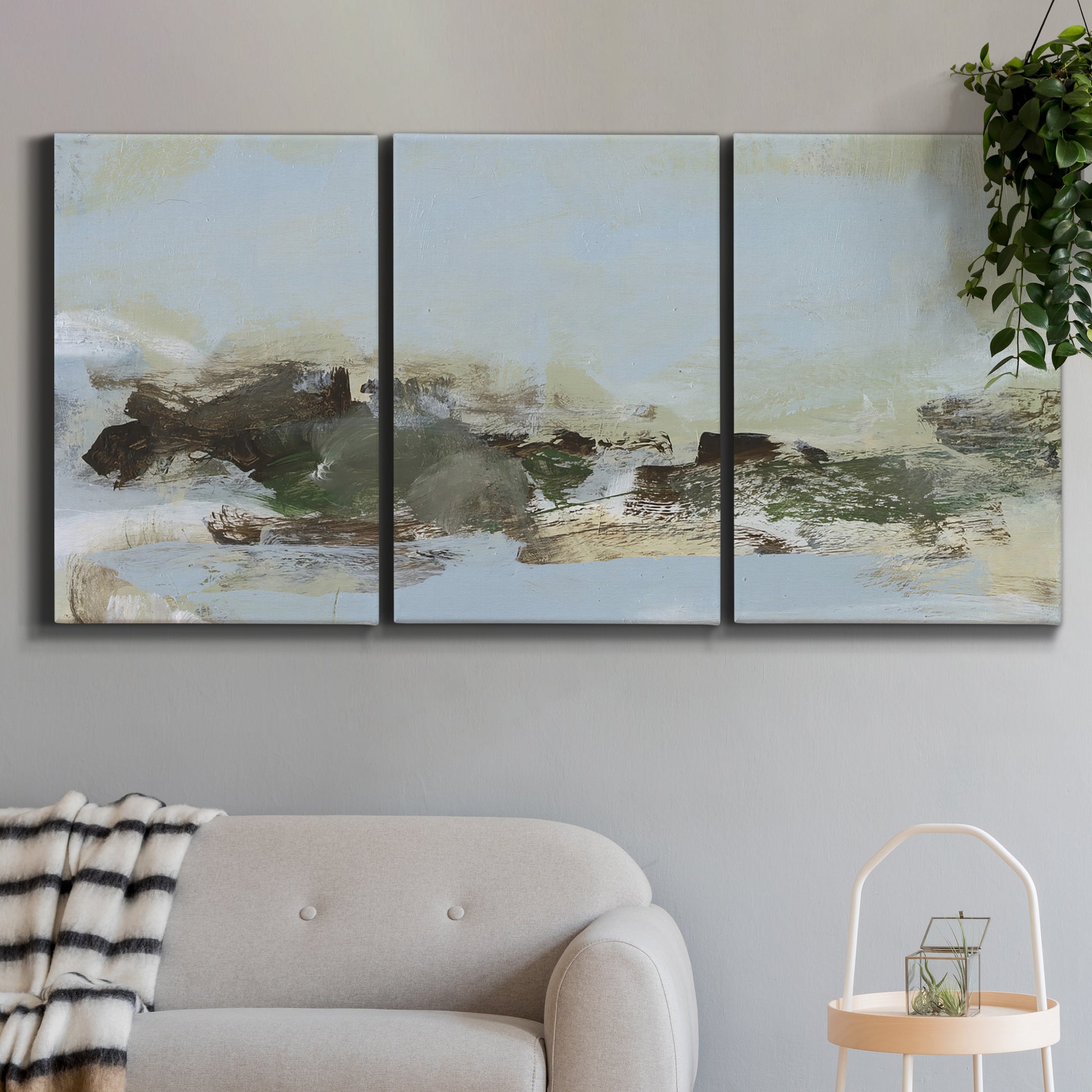 Three-panel canvas wall art featuring minimal abstract summer landscape, displayed in a modern living room above a sofa.