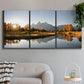 Three-panel canvas wall art featuring river canyon landscape photograph, displayed in a modern living room above a sofa.