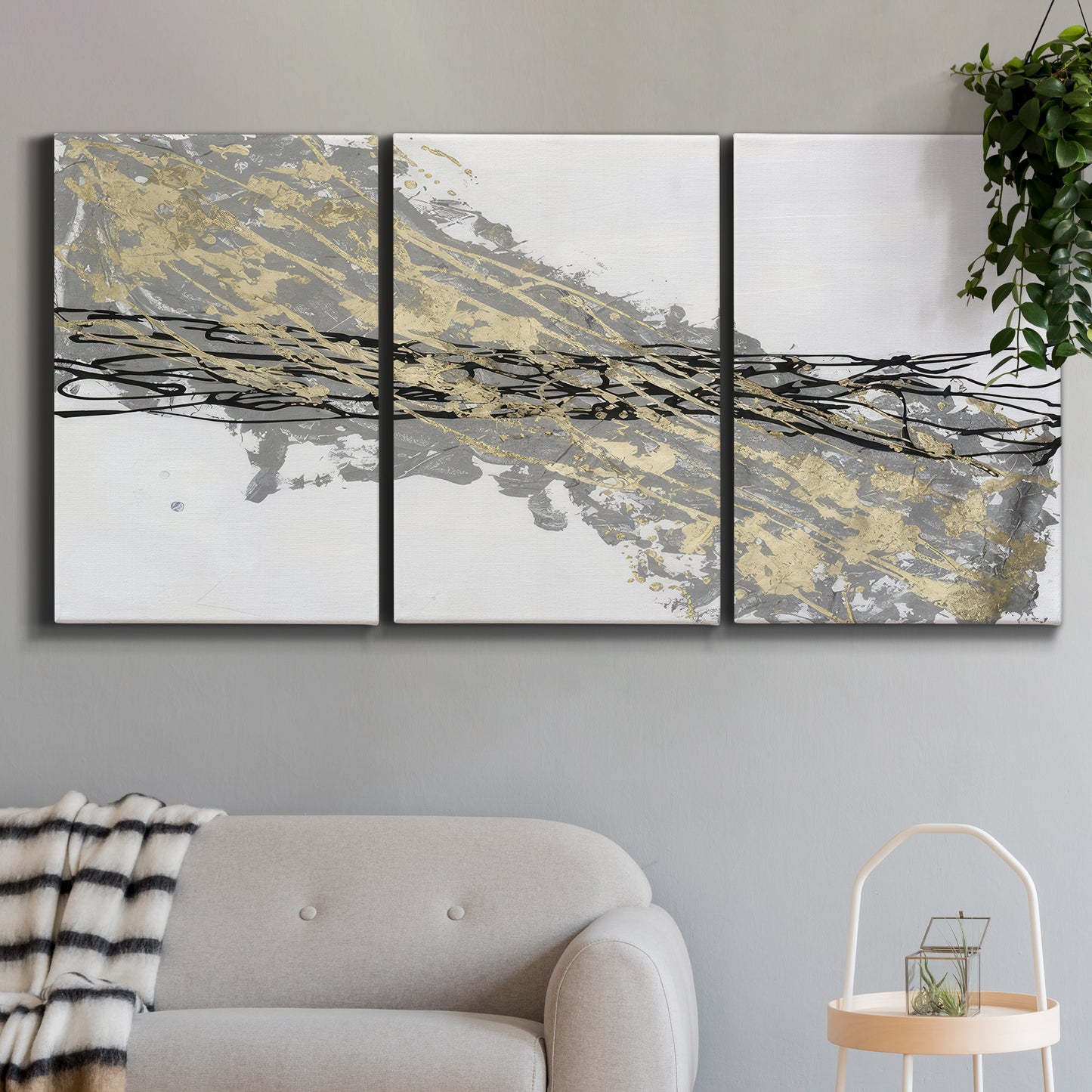 Three-panel canvas wall art featuring light modern abstract wind patterns, displayed in a modern living room above a sofa.
