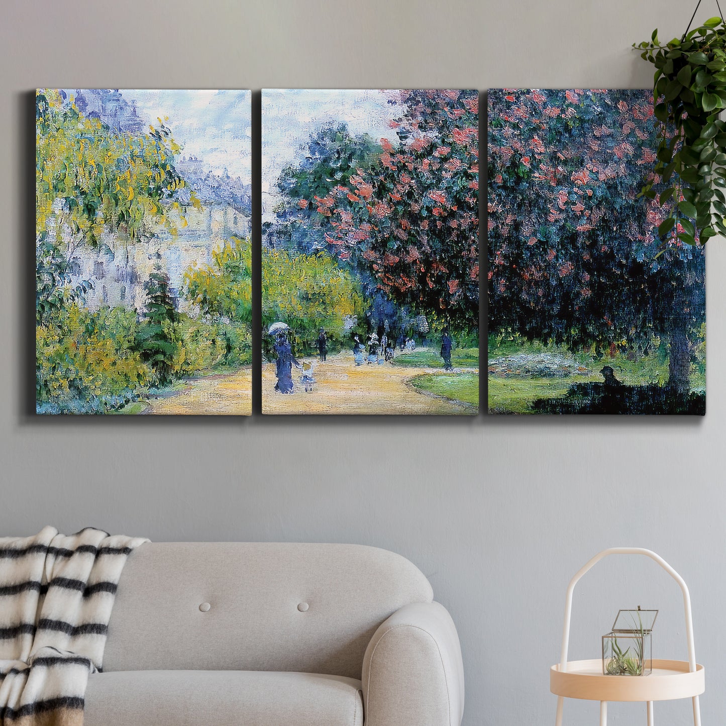 Three-panel canvas wall art featuring formal city park with trees, displayed in a modern living room above a sofa.