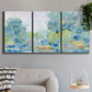 Three-panel canvas wall art featuring quiet abstract morning landscape, displayed in a modern living room above a sofa.