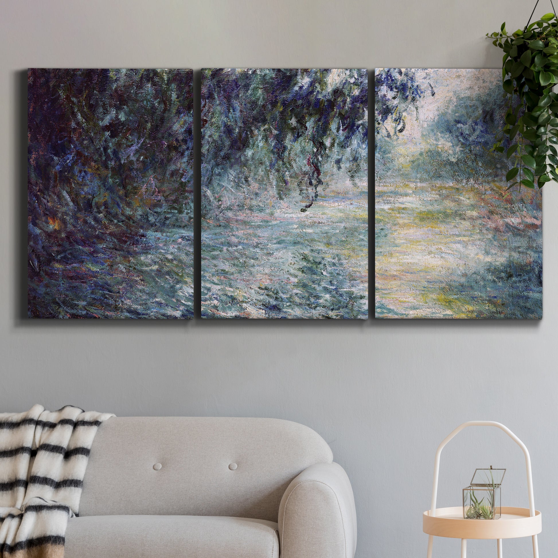 Three-panel canvas wall art featuring misty river scene in morning light, displayed in a modern living room above a sofa.