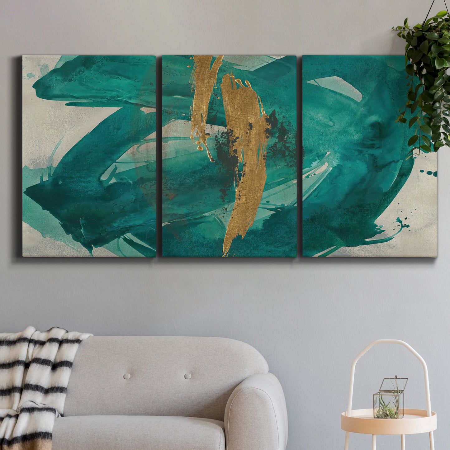 Three-panel canvas wall art featuring interconnected abstract flowing forms, displayed in a modern living room above a sofa.