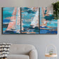 Three-panel canvas wall art featuring graphic pop style sailboats, displayed in a modern living room above a sofa.