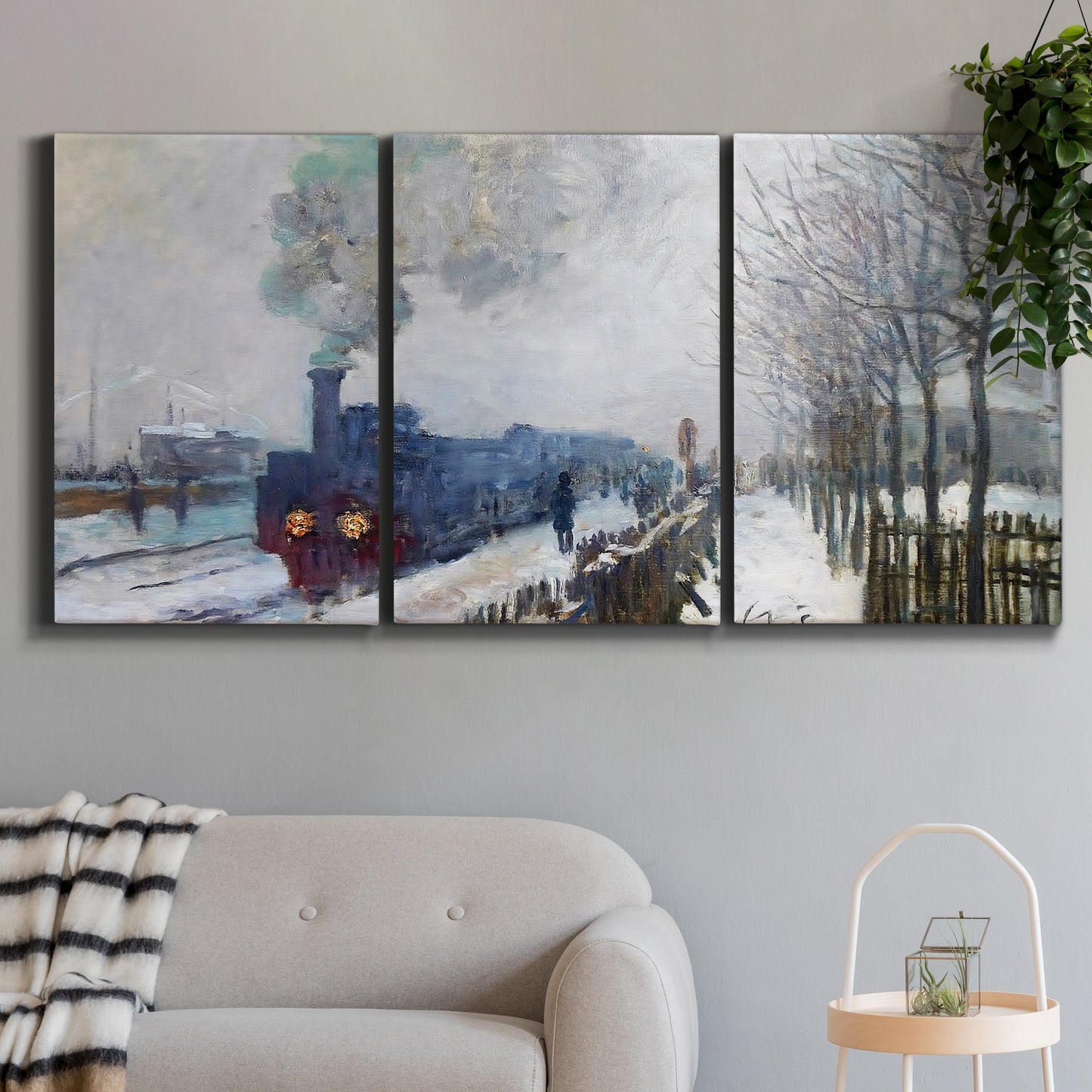 Three-panel canvas wall art featuring steam train in snowy landscape, displayed in a modern living room above a sofa.
