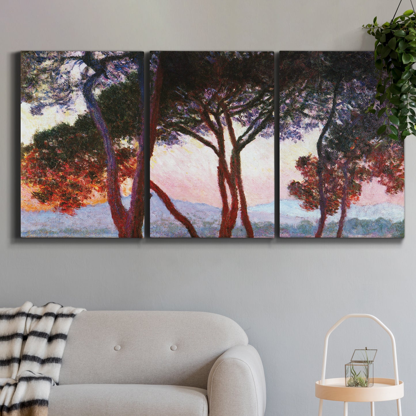 Three-panel canvas wall art featuring sunlit pines along mediterranean coast, displayed in a modern living room above a sofa.