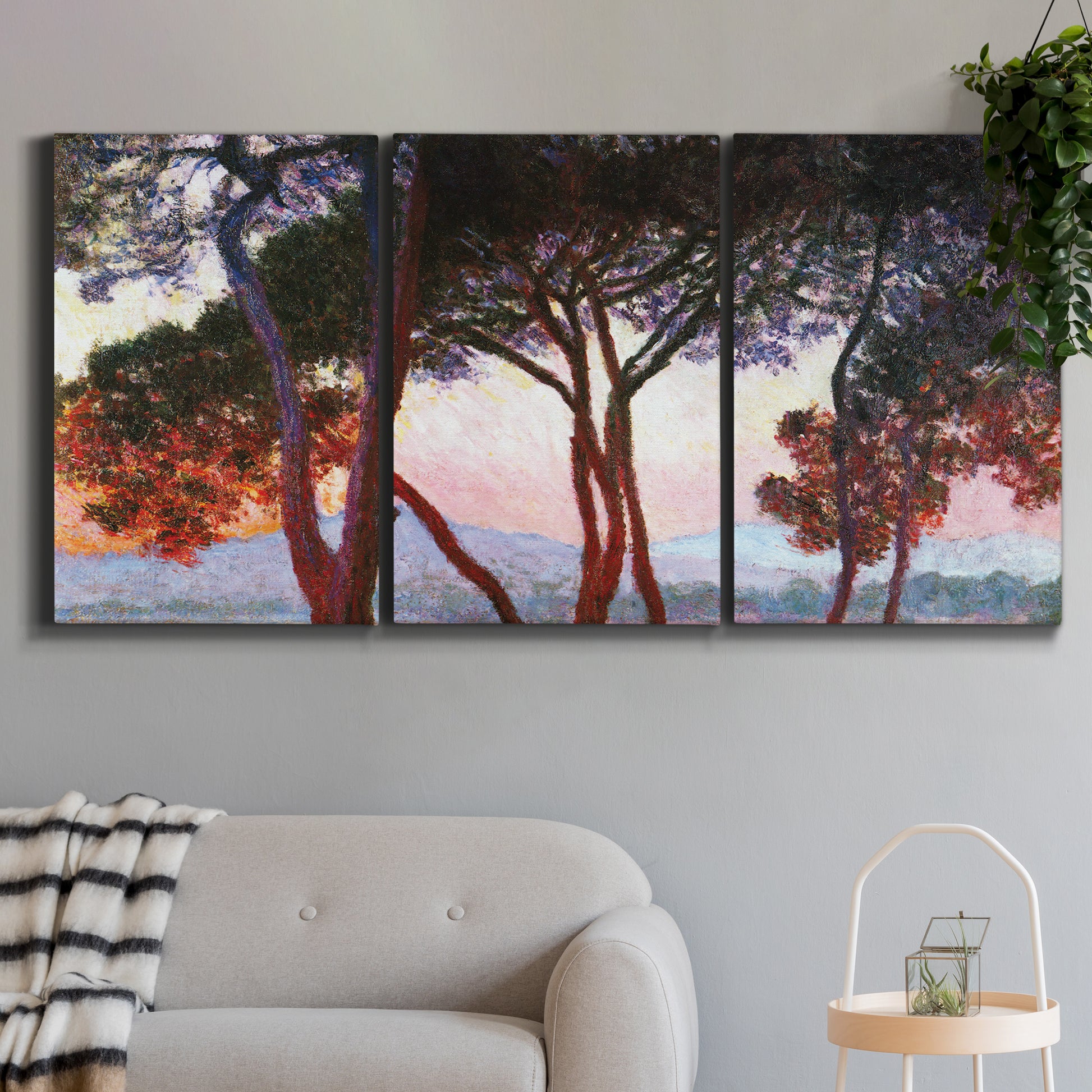 Three-panel canvas wall art featuring sunlit pines along mediterranean coast, displayed in a modern living room above a sofa.