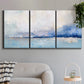 Three-panel canvas wall art featuring abstract bay with rhythmic forms, displayed in a modern living room above a sofa.