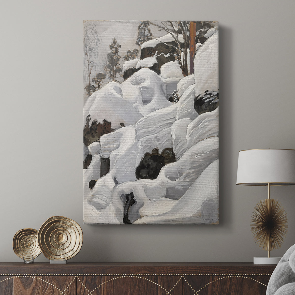 Canvas art print featuring a rugged snowy landscape with dense forest and natural formations displayed in a modern interior space.