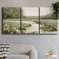 Three-panel canvas wall art featuring narrow path through quiet landscape, displayed in a modern living room above a sofa.