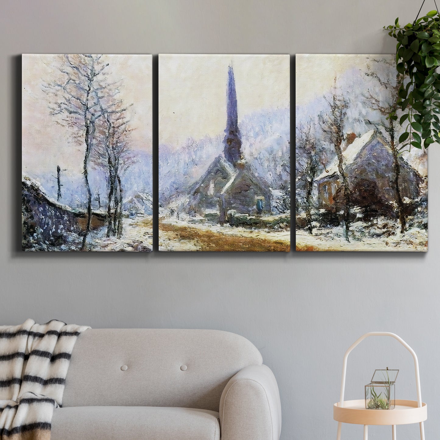 Three-panel canvas wall art featuring snow covered road leading to village, displayed in a modern living room above a sofa.