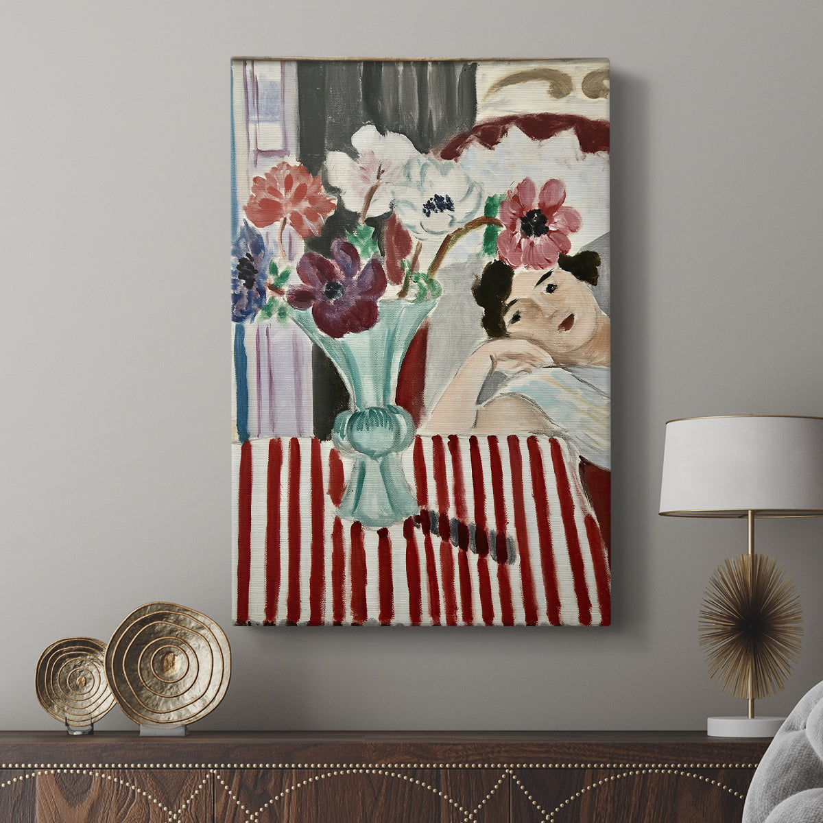 Canvas art print featuring a bright portrait with patterned background and soft features displayed in a modern interior space.