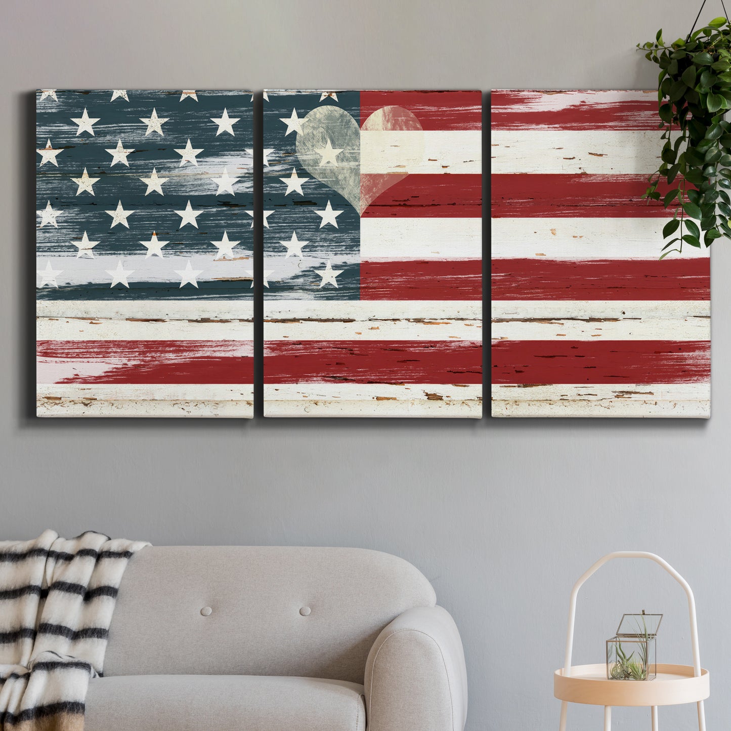 Three-panel canvas wall art featuring rustic american flag country style, displayed in a modern living room above a sofa.
