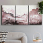 Three-panel canvas wall art featuring soft pink abstract scenic layers, displayed in a modern living room above a sofa.