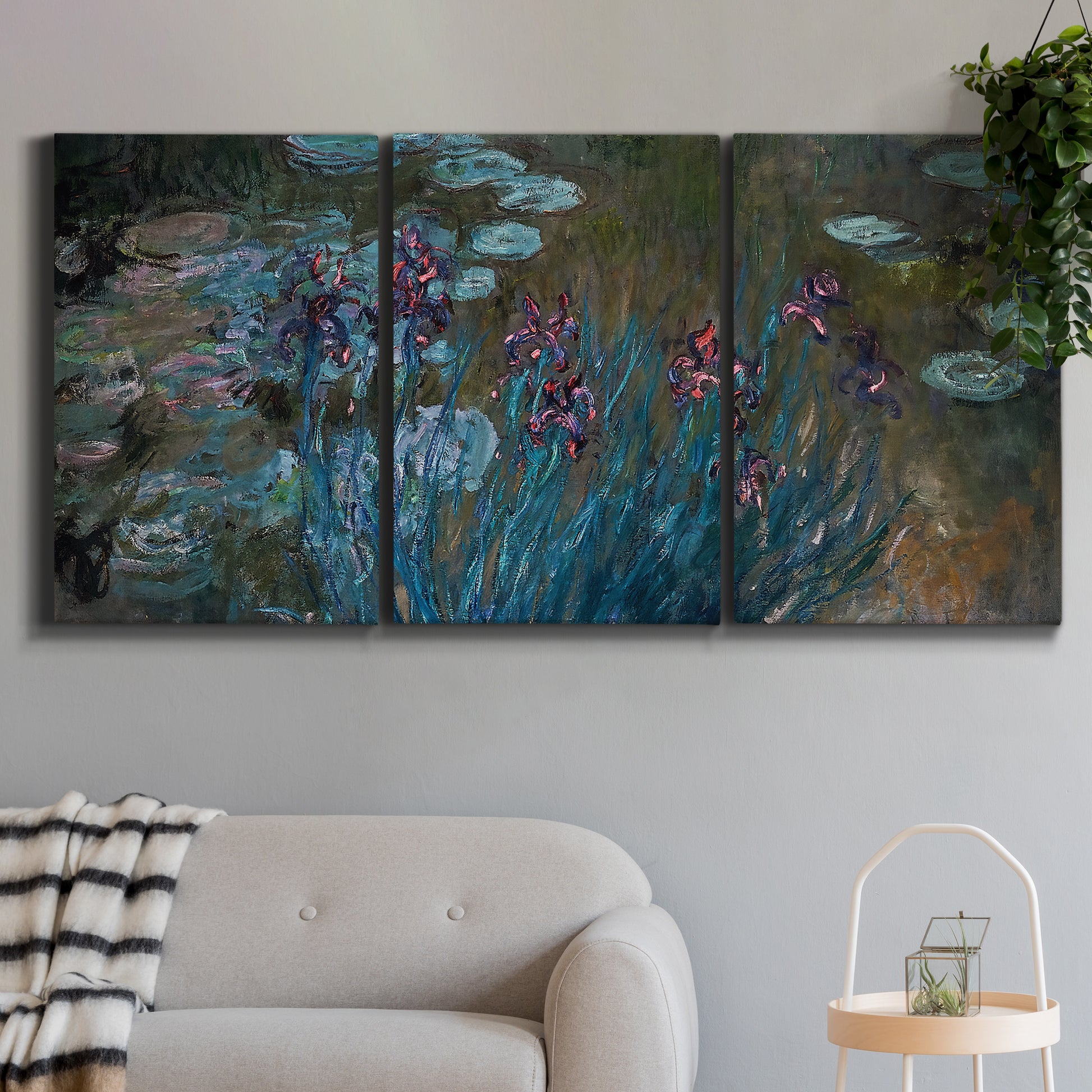 Three-panel canvas wall art featuring water lilies on reflective pond, displayed in a modern living room above a sofa.