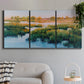 Three-panel canvas wall art featuring pastoral marshland landscape, displayed in a modern living room above a sofa.
