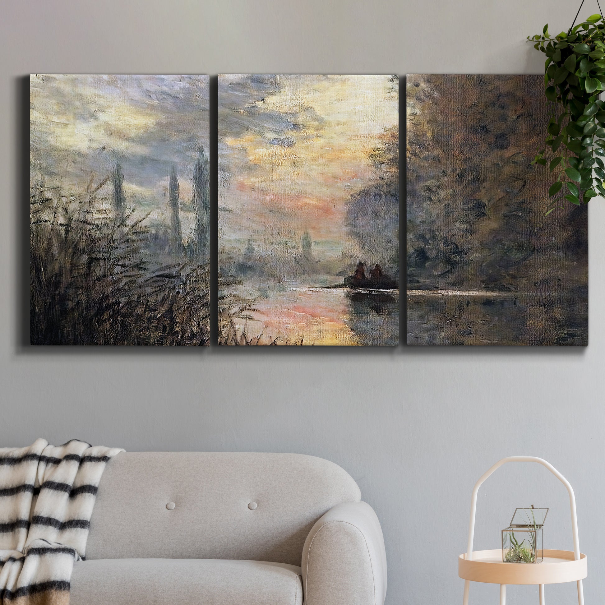 Three-panel canvas wall art featuring winter river sunset with reflections, displayed in a modern living room above a sofa.