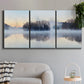 Three-panel canvas wall art featuring misty water landscape photograph, displayed in a modern living room above a sofa.