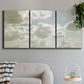 Three-panel canvas wall art featuring whimsical vertical tree landscape, displayed in a modern living room above a sofa.