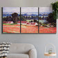 Three-panel canvas wall art featuring poppy field at giverny in bloom, displayed in a modern living room above a sofa.